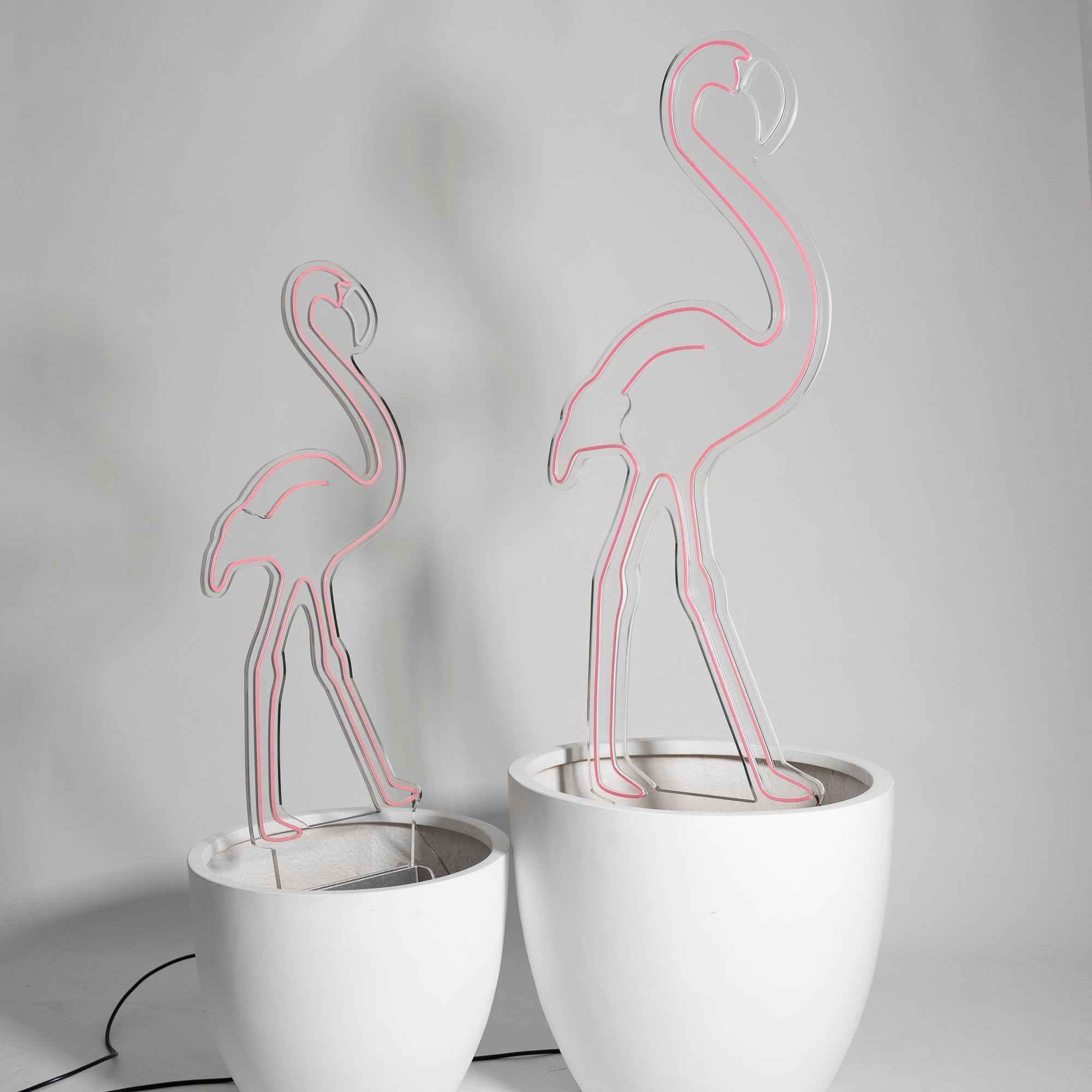 Pink flamboyance of Flamingos In Pot Neon (Set of 2) - Neon Sign Hire Brisbane